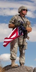 Soldier with Flag in Iraq