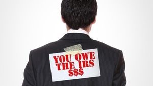 You Owe Tax Sign on Back